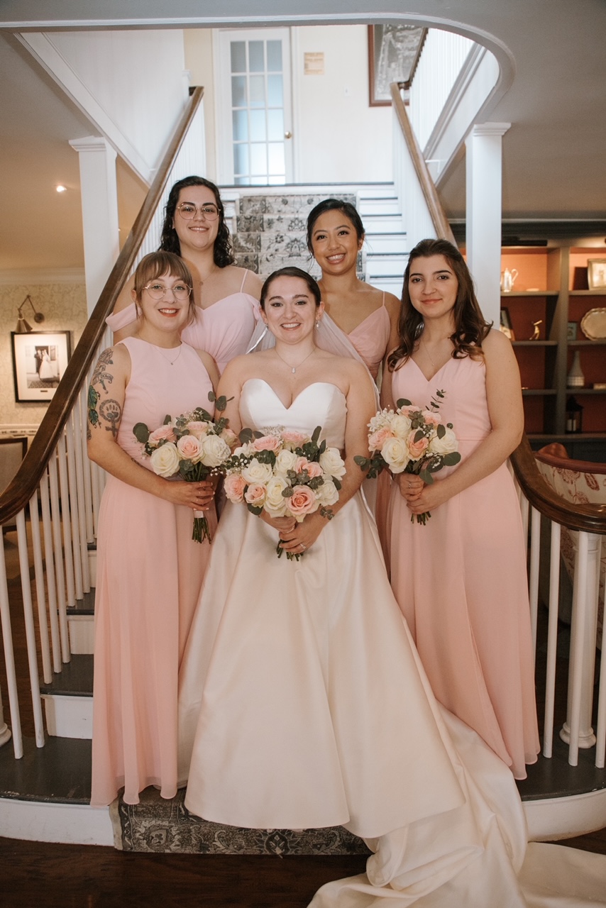 Beautiful bridal party portrait on classic staircase
